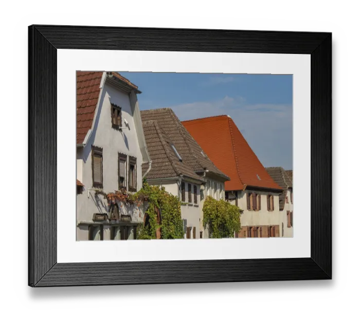 Framed Print : Street scene with historic half-timbered houses and striking red roof tiles Framed Print : Street scene with historic half-timbered houses and striking red roof tiles