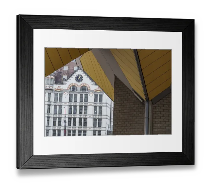 Framed Print : A historic building with a clock is framed by modern architecture with yellow panels