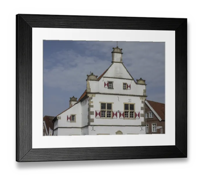 Framed Print : Historic, white and red half-timbered house with ornate windows