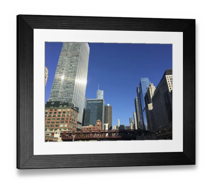Framed Print : View of modern skyscrapers in the city under a clear blue sky