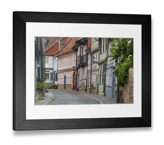 Framed Print : Narrow old town alley with half-timbered houses and traditional architectural elements