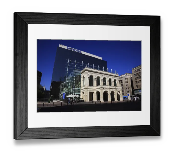Framed Print : Hotel Novotel, modern glass facade building behind the facade of a historic house Framed Print : Hotel Novotel, modern glass facade building behind the facade of a historic house