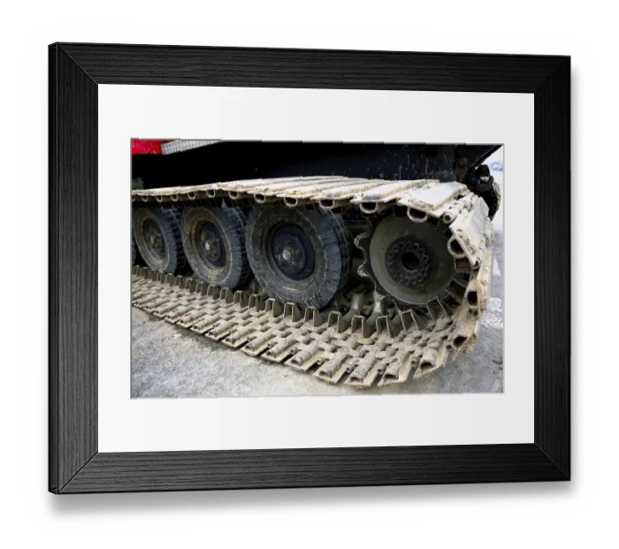 Framed Print : Caterpillars steel details and wheels from a snowblower vehicle