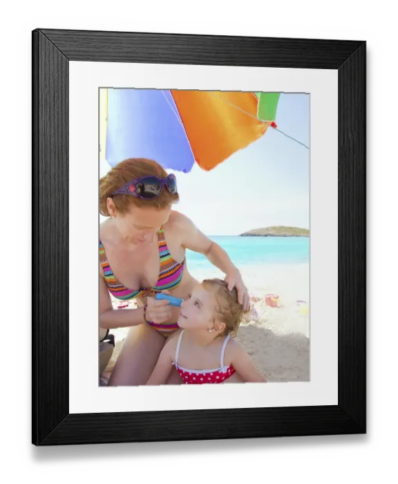 Framed Print : Daughter and mother in beach with sunscreen in bikini Framed Print : Daughter and mother in beach with sunscreen in bikini