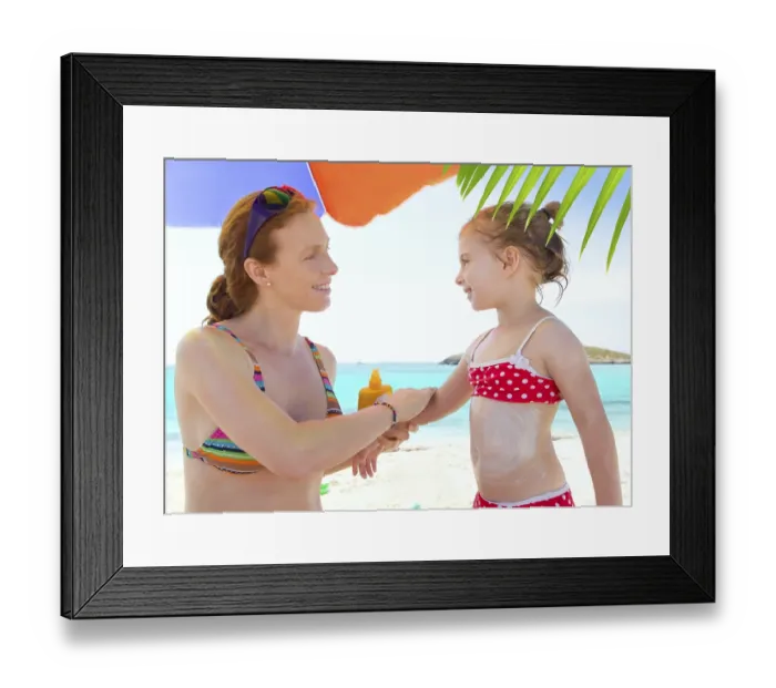 Framed Print : Daughter and mother in beach with sunscreen in bikini Framed Print : Daughter and mother in beach with sunscreen in bikini