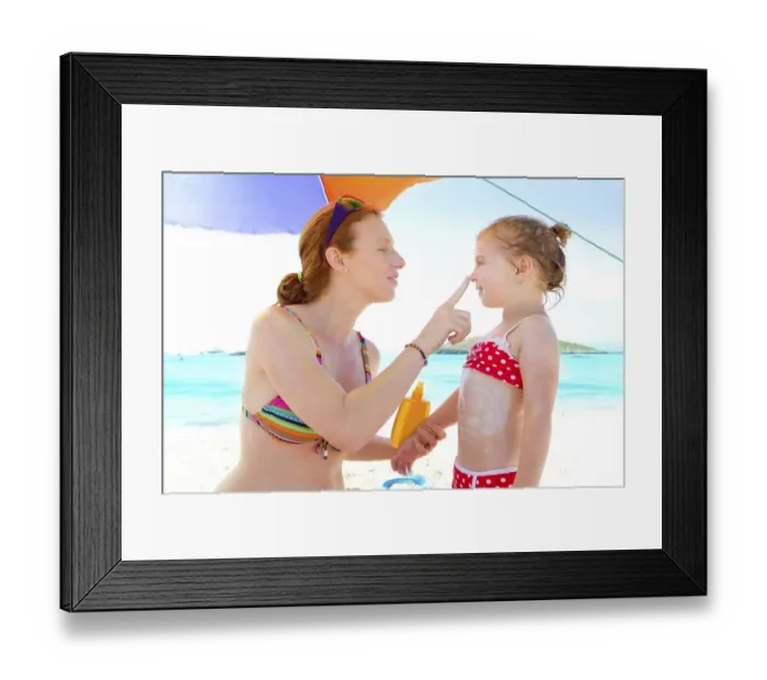 Framed Print : Daughter and mother in beach with sunscreen in bikini Framed Print : Daughter and mother in beach with sunscreen in bikini