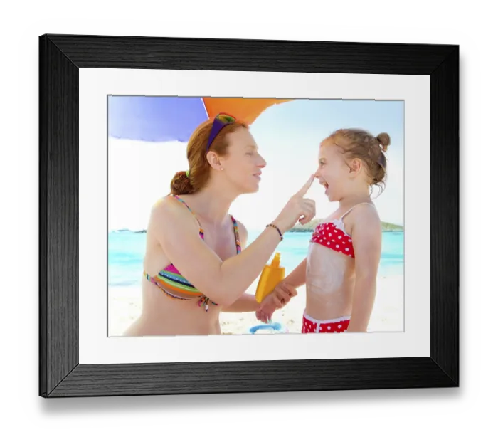 Framed Print : Daughter and mother in beach with sunscreen in bikini Framed Print : Daughter and mother in beach with sunscreen in bikini