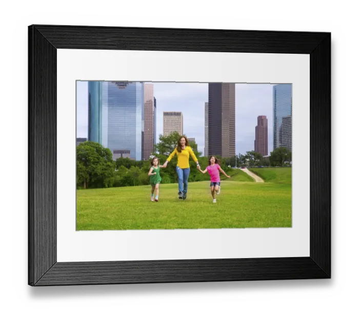 Framed Print : Mother and daughters walking holding hands on modern city skyline over park green lawn Framed Print : Mother and daughters walking holding hands on modern city skyline over park green lawn