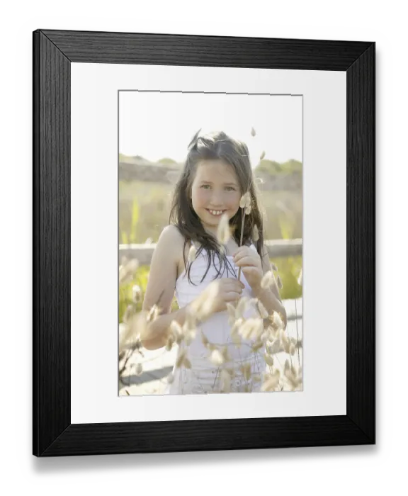 Framed Print : Girl at the park playing with flower spike in summertime Framed Print : Girl at the park playing with flower spike in summertime