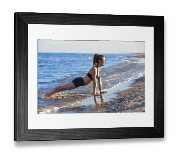 Framed Print : Pilates yoga workout exercise outdoor on the beach sand Framed Print : Pilates yoga workout exercise outdoor on the beach sand
