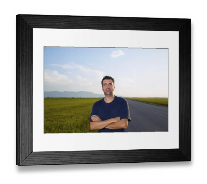 Framed Print : Mid age man in road at meadows posing with crossed arms cereal fields