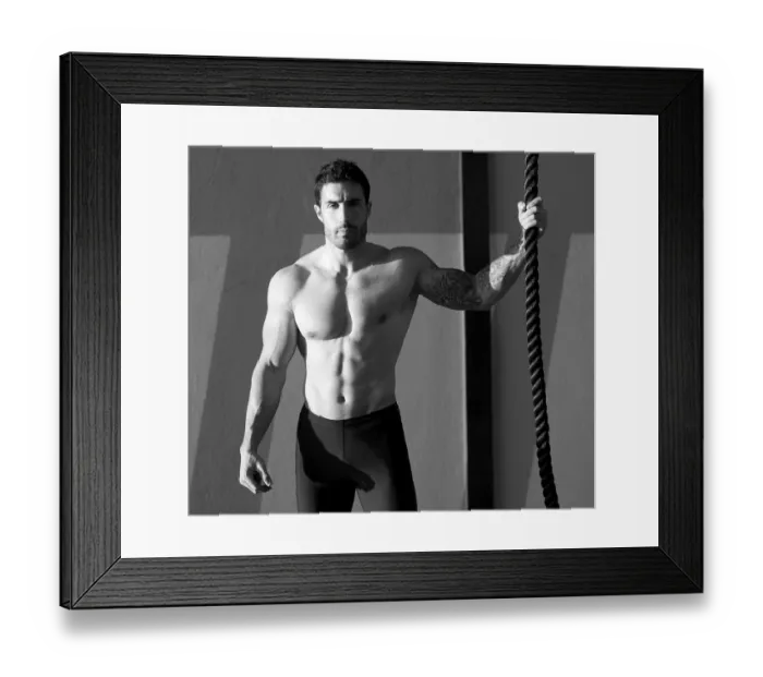 Framed Print : Crossfit gym handsome man holding hand a climbing rope