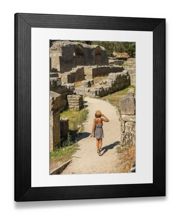 Framed Print : Woman walking in the archaeological ruins of Butrint or Butrinto National Park in Albania