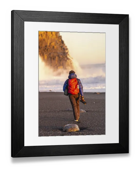 Framed Print : Adventurous photographer woman in winter in Iceland visiting the Reynisfjara Black Sand Beach