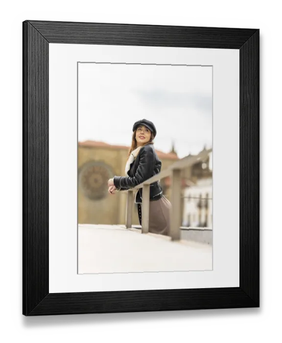 Framed Print : Fashionable woman wearing a newsboy cap and leather jacket