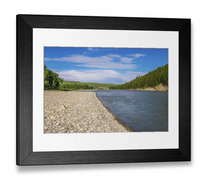 Framed Print : The Bow River flows past the cobble river bank at McKinnon Flats southeast of Calgary