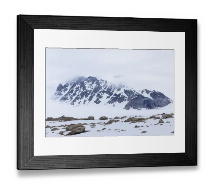 Framed Print : Large boulders in the snow, mountain range