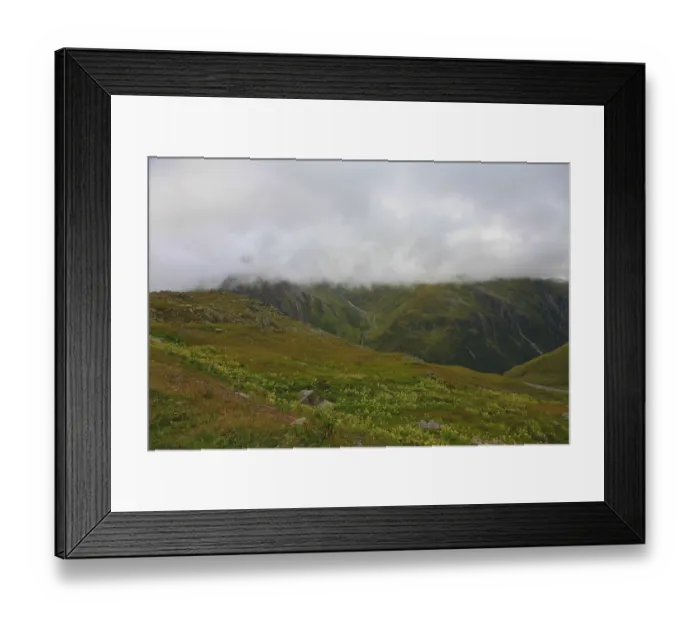 Framed Print : Misty mountain landscape with green meadows and a narrow path Framed Print : Misty mountain landscape with green meadows and a narrow path