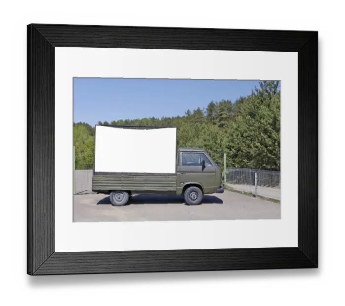 Framed Print : An old no name green army truck with a empty billboard set in a pine forest