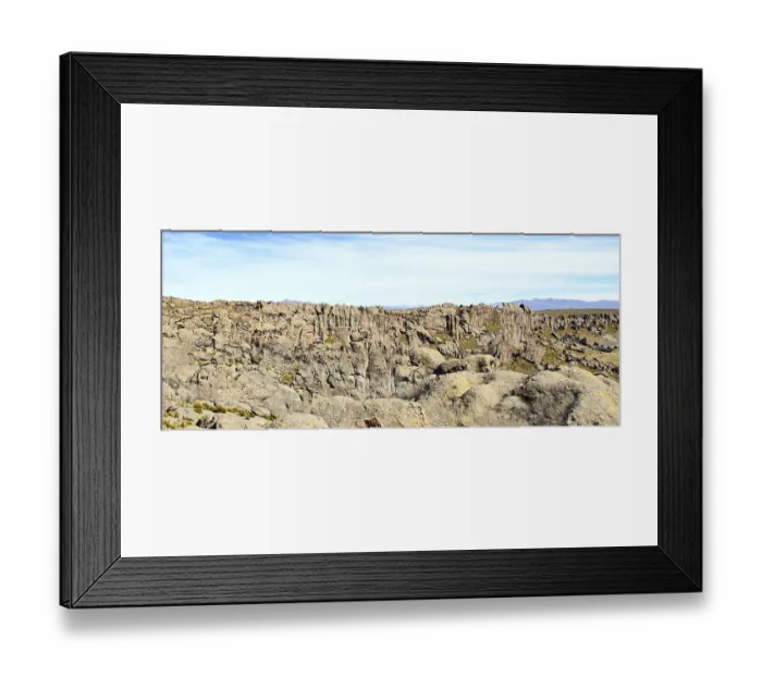Framed Print : The solid Peruvian mountain wall consists of many porous vertical aged red granite stones