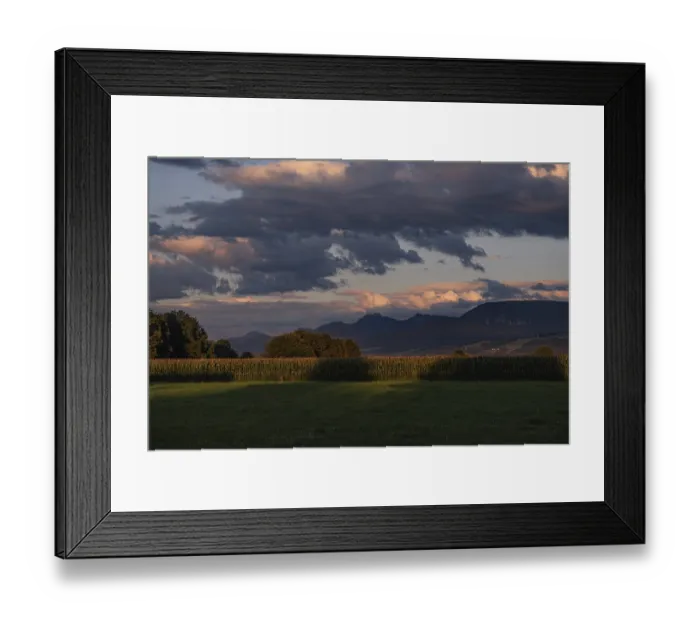 Framed Print : Evening landscape with mountains in the background Framed Print : Evening landscape with mountains in the background