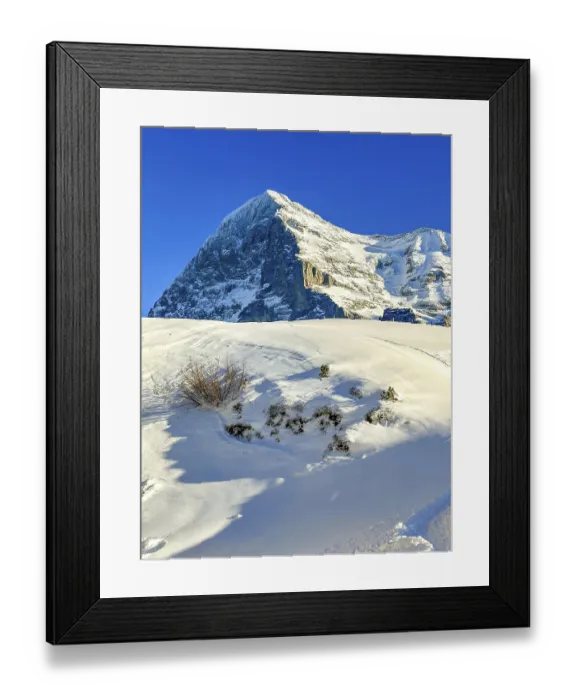 Framed Print : Snowcapped Mountain Peak Eiger North Face at 3970 Meter High in a Sunny Winter Day with Blue Sky in Grindelwald