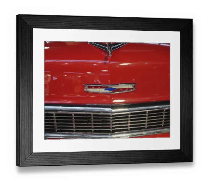 Framed Print : Close-up of a red classic car with distinctive emblem and radiator grille