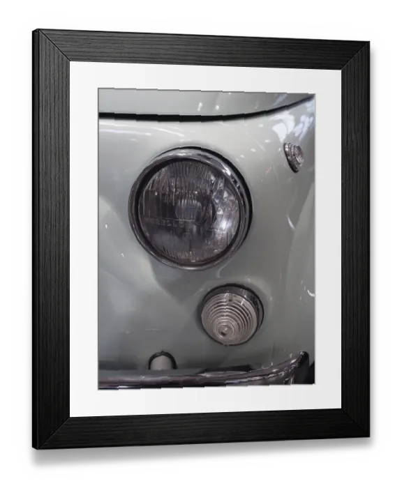Framed Print : Close-up of a light blue vintage car with distinctive headlights and chrome