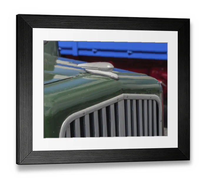 Framed Print : Close-up of a green classic car with distinctive radiator grille and bodywork details