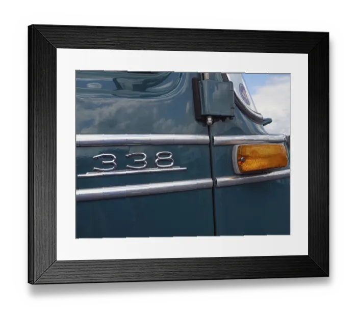 Framed Print : Green vintage car with tail light and the number 338 on the bodywork