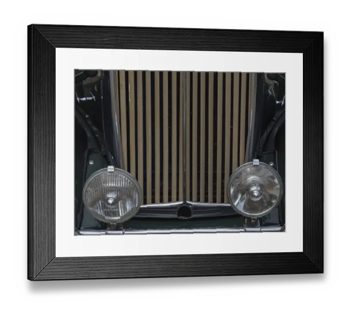 Framed Print : Close-up of a green vintage car with vertical radiator grille and round headlights Framed Print : Close-up of a green vintage car with vertical radiator grille and round headlights