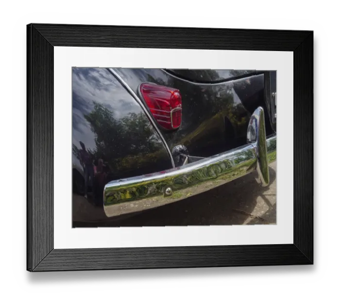 Framed Print : Black vintage car with chrome-plated bumper and illuminated tail light