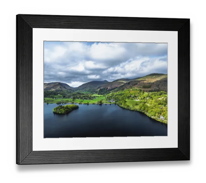 Framed Print : Farms and Mountains over road A591 from a drone