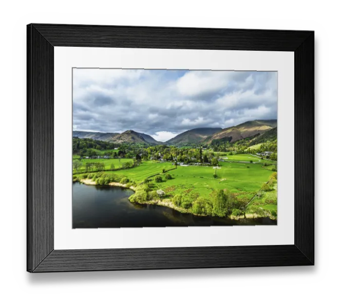 Framed Print : Farms and Mountains over road A591 from a drone