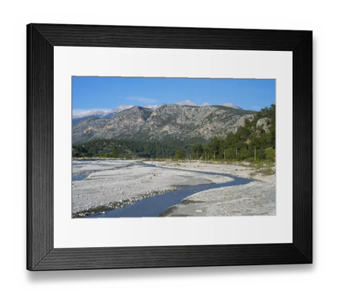 Framed Print : A calm river flows through a wide gravel bed