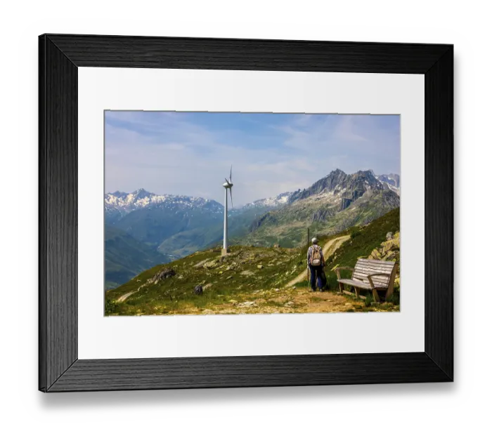 Framed Print : Hiker and Wind Turbine and Mountain with Glacier in the Swiss Alps and Against Blue Sky Framed Print : Hiker and Wind Turbine and Mountain with Glacier in the Swiss Alps and Against Blue Sky