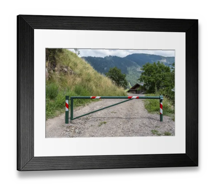 Framed Print : Barrier on gravel path in rural mountain region