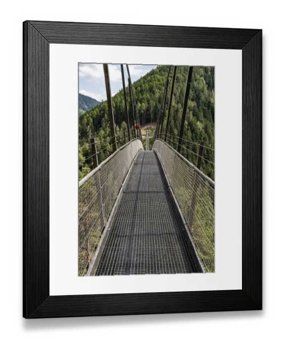 Framed Print : Long suspension bridge over a forest gorge in the South Tyrolean Alps