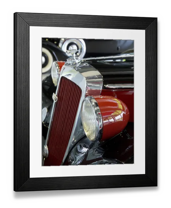 Framed Print : Red vintage car with round headlights and retro-style chrome details