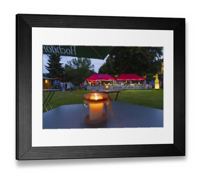 Framed Print : Night shot of a festival with candlelight on tables
