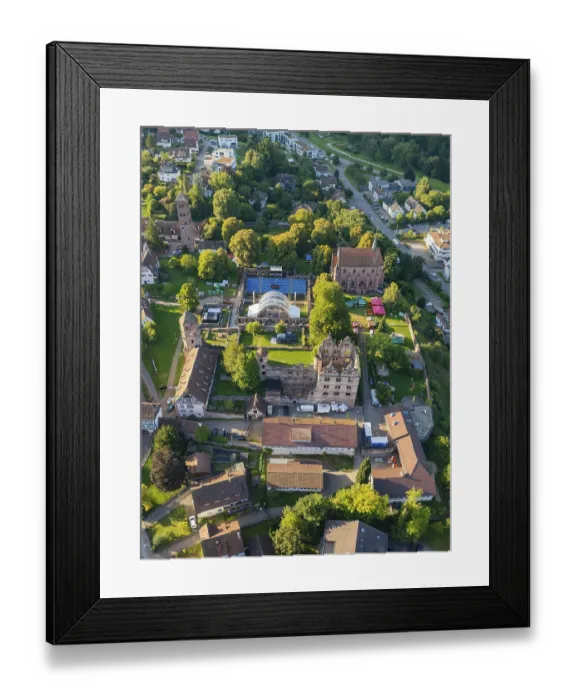 Framed Print : Aerial view of a green cityscape with historic buildings in summer