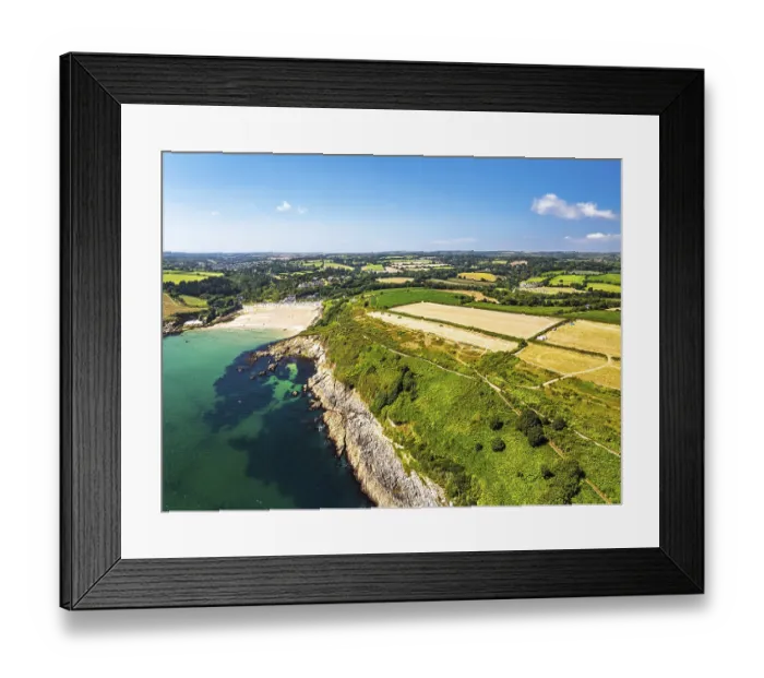 Framed Print : Cliffs over Maenporth Beach and Stack Point from a drone