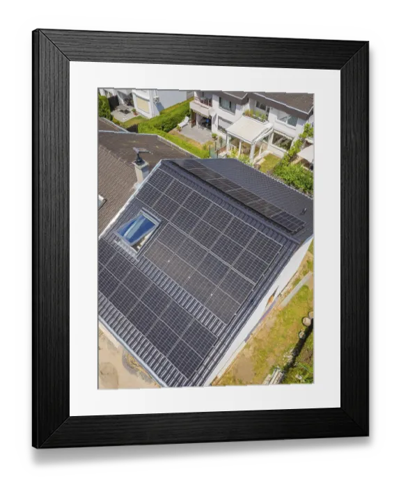 Framed Print : Roof with solar modules in a residential area with green surroundings Framed Print : Roof with solar modules in a residential area with green surroundings