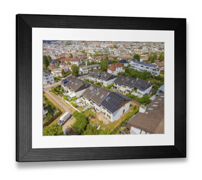 Framed Print : Aerial view of a suburb with many houses that have solar modules Framed Print : Aerial view of a suburb with many houses that have solar modules