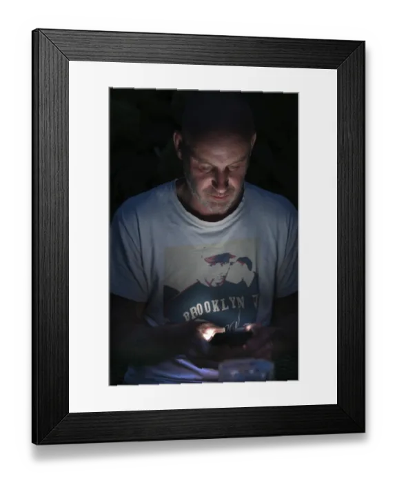 Framed Print : Young man on mobile phone at night Framed Print : Young man on mobile phone at night