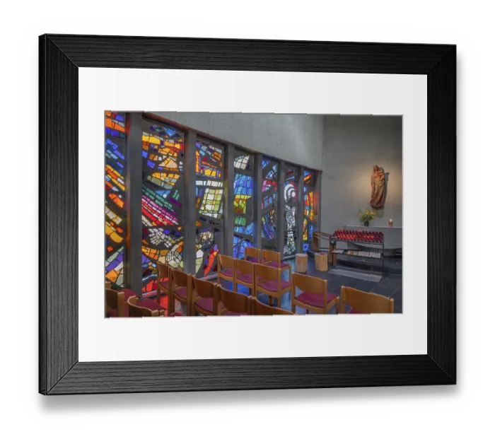 Framed Print : Colourful stained glass windows and a statue of the Virgin Mary with sacrificial candles