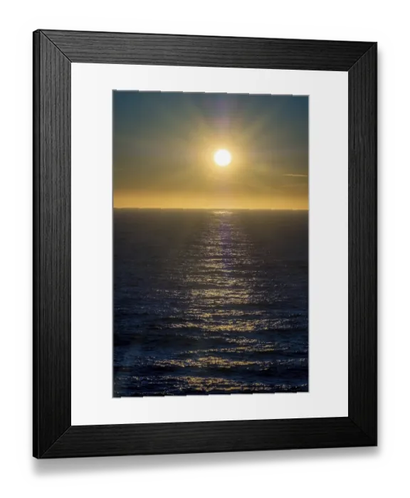 Framed Print : Sunset by the sea with star effect