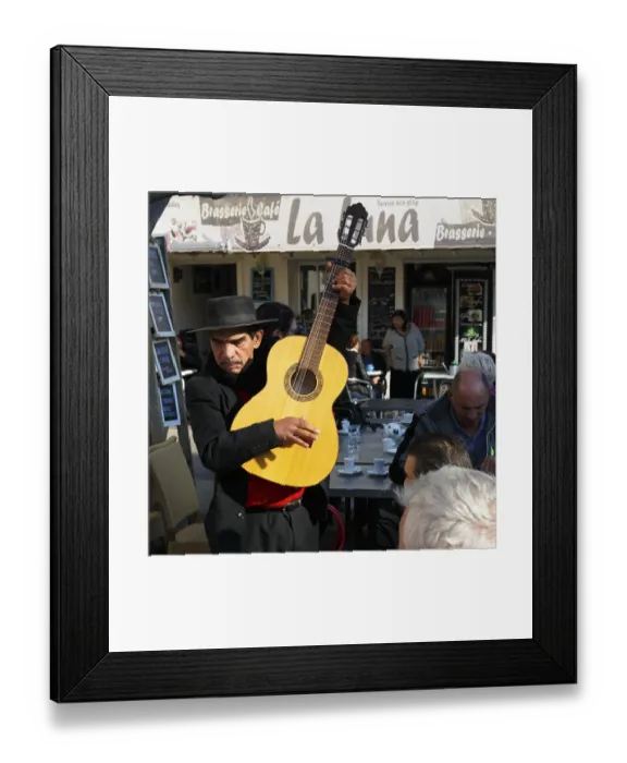 Framed Print : Traditional guitar player, singer in a restaurant Framed Print : Traditional guitar player, singer in a restaurant