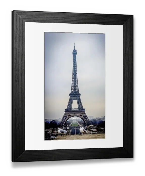 Framed Print : Eiffel Tower looms majestically against a gray sky in Paris