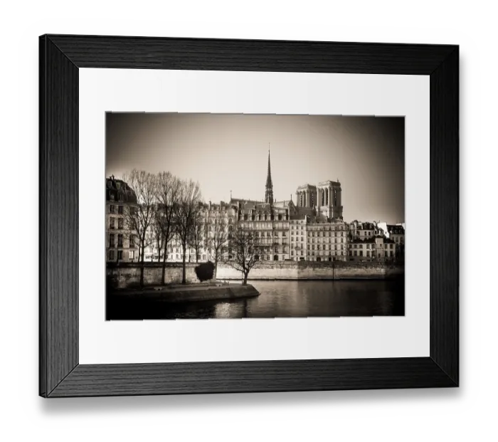 Framed Print : The exterior of Notre Dame Cathedral is prominently displayed along the Seine River in Paris Framed Print : The exterior of Notre Dame Cathedral is prominently displayed along the Seine River in Paris